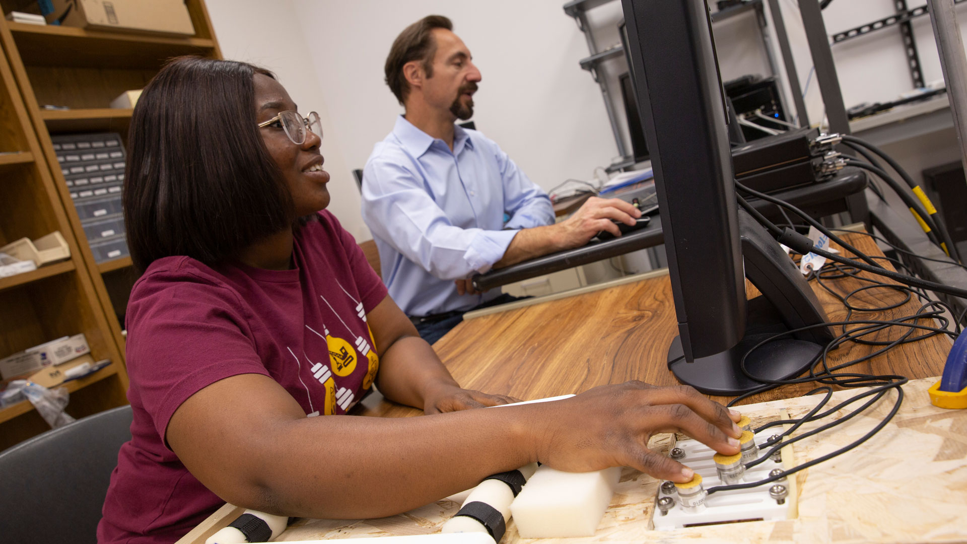 Biomedical engineering graduate student Emmanuella Tagoe works with Professor Marco Santello.