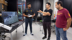 Manthan Chelenahalli Satish (left) discusses computer vision research with Assistant Professor Yezhou “YZ” Yang (center) and Mohammad Farhadi (right) as part of his MORE research project.
