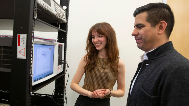 Hailey Warner (left), an electrical engineering junior, researches the physics of switching behavior in memristor devices for neuromorphic or “brain-inspired” computing with Assistant Professor Ivan Sanchez Esqueda (right) as part of a semiconductor manufacturing FURI research project sponsored by TSMC.