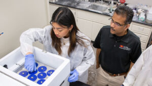 Civil engineering junior Lana Banzon (left) studies how to use mining waste products for concrete in the lab of Narayanan Neithalath (right), a professor of civil and environmental engineering, as part of a FURI research project.
