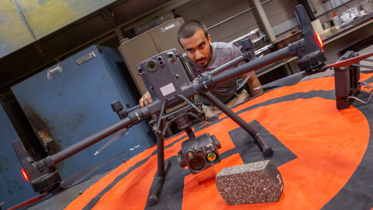 Civil engineering major Othman Al-Alawi works on a FURI research project to harness drones with thermal cameras to help evaluate sustainable pavement treatments' impact on heat islands.