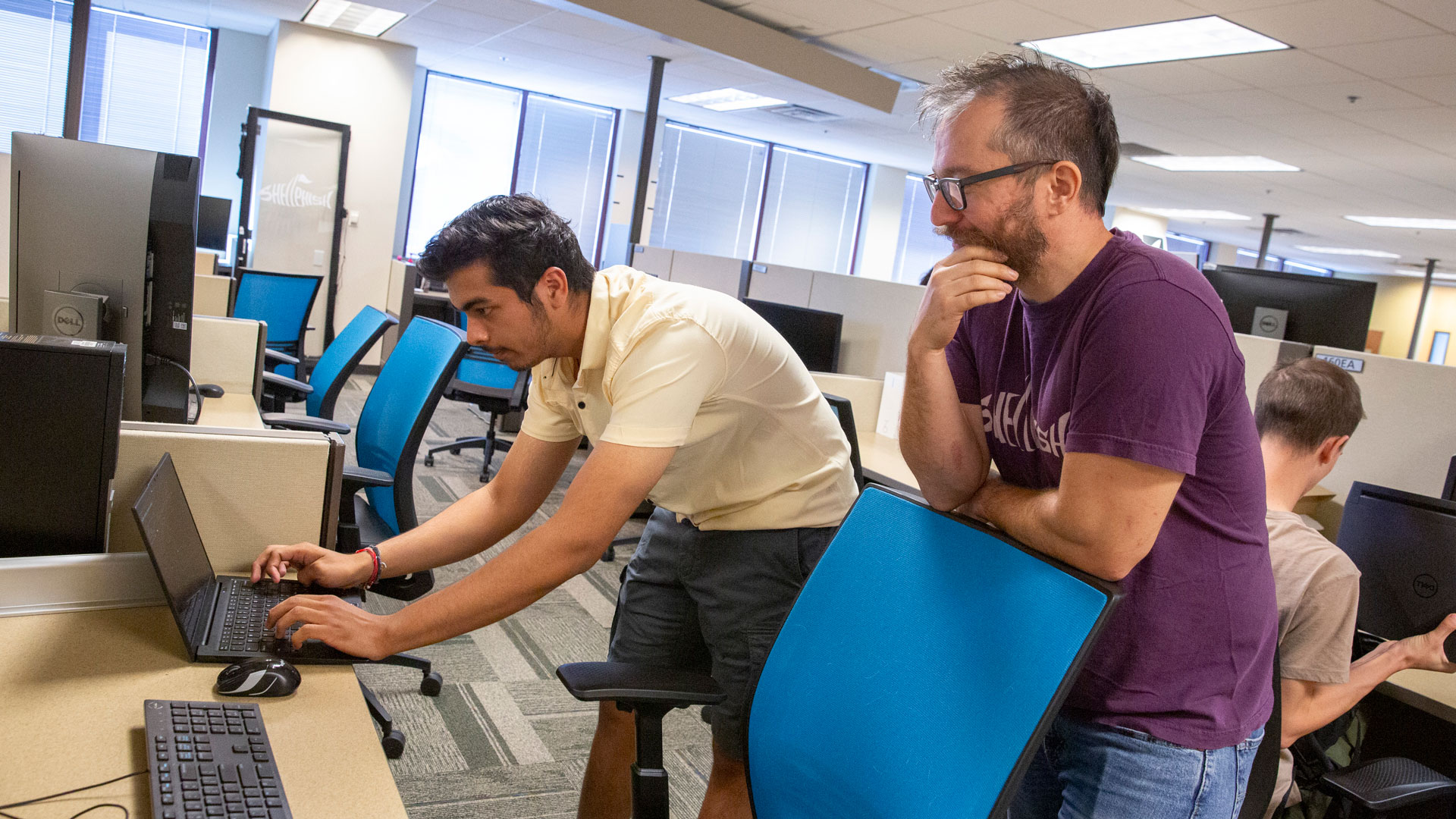 Computer science major Vishal Juneja (left) works with faculty mentor Yan Shoshitaishvilli (right) on a project to improve the security and reliability of software by improving the Google error-detecting tool called AddressSanitizer.