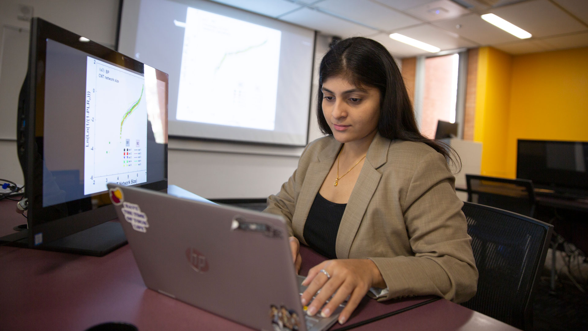 MORE student researcher Aishwarya Katkar studies how machine learning can help expedite material analysis to develop semiconductor device components.