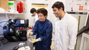 An ASU FURI student works in the lab with his mentor.