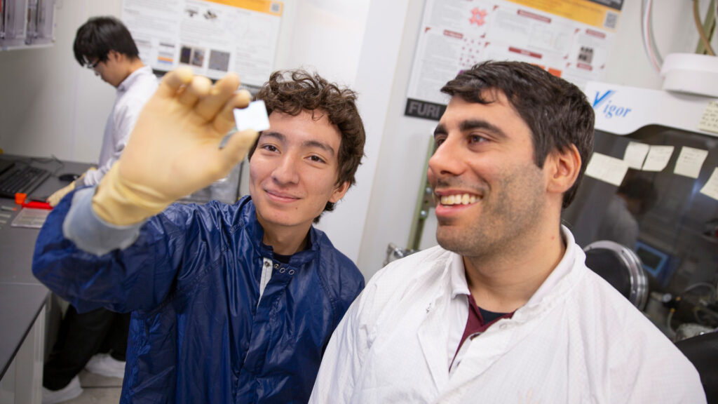 An ASU FURI student works in the lab with his mentor.