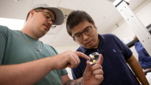 An ASU FURI student works in the lab with his mentor.