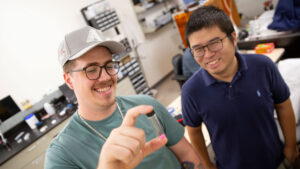 An ASU FURI student works in the lab with his mentor.