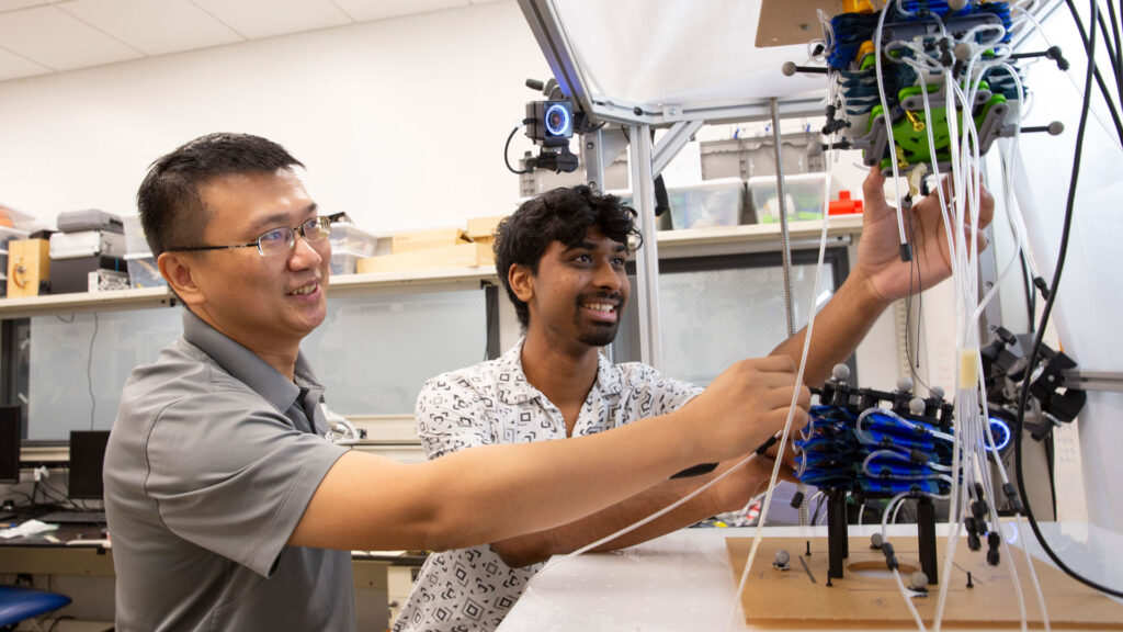 An ASU FURI student works in the lab with his mentor.